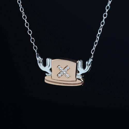 Detail of cubic zirconia in hat necklace