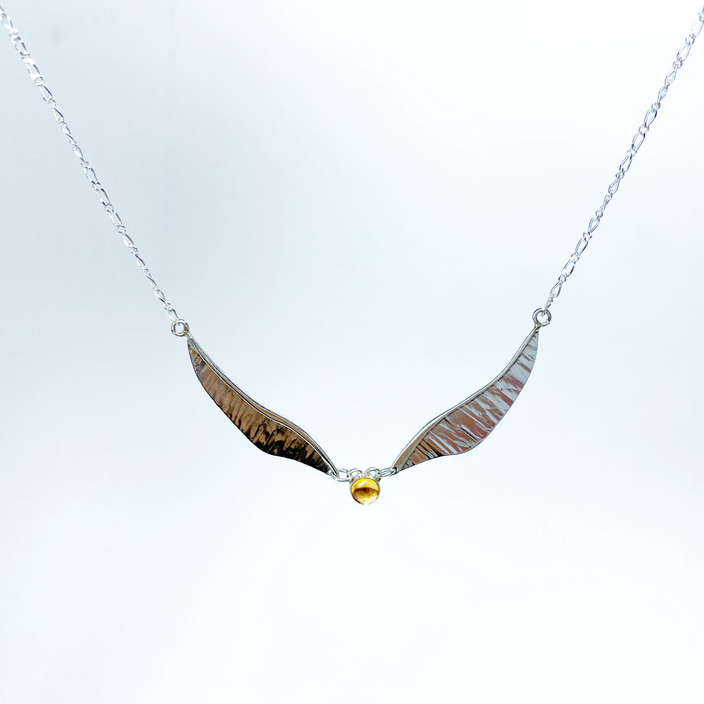 Winged pendant detail with golden citrine and moving structure