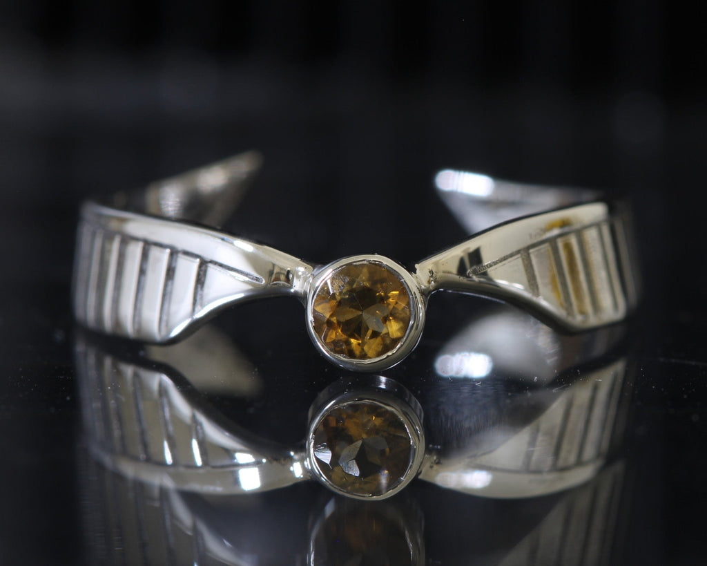 Golden Wing ring worn, showing open ring and wing details