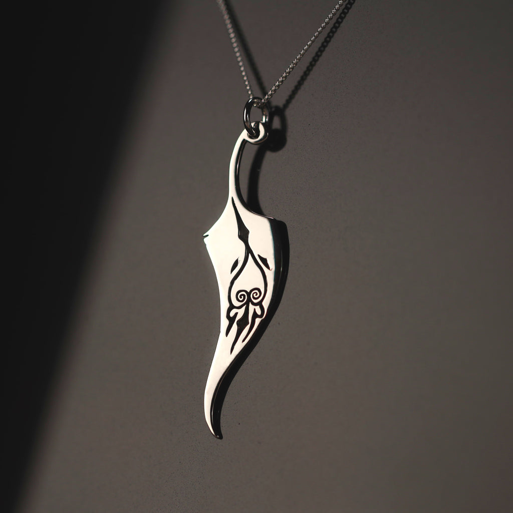 Sterling silver feather necklace with engraved symbol