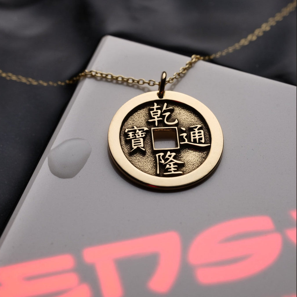 Detail of engraved hexagram coin pendant