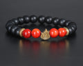 Hi bracelet in sterling silver with gold plated fire symbol, black onyx and red agate beads