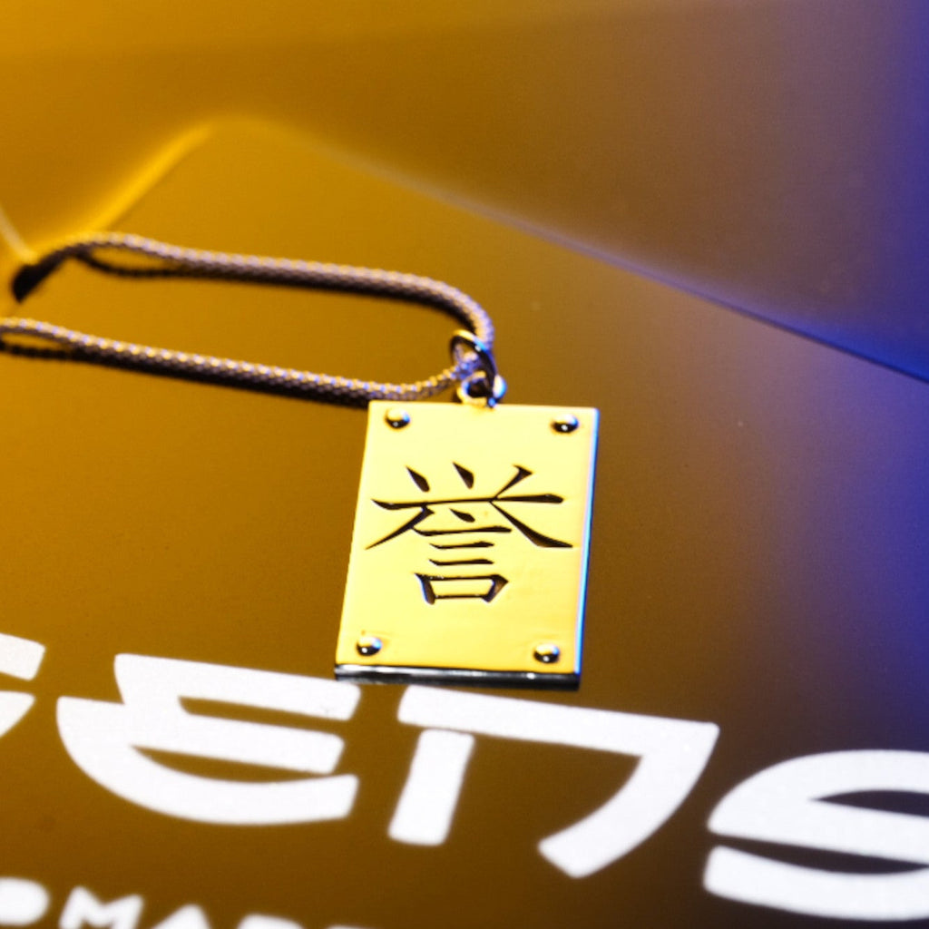 Side view of kanji plaque necklace