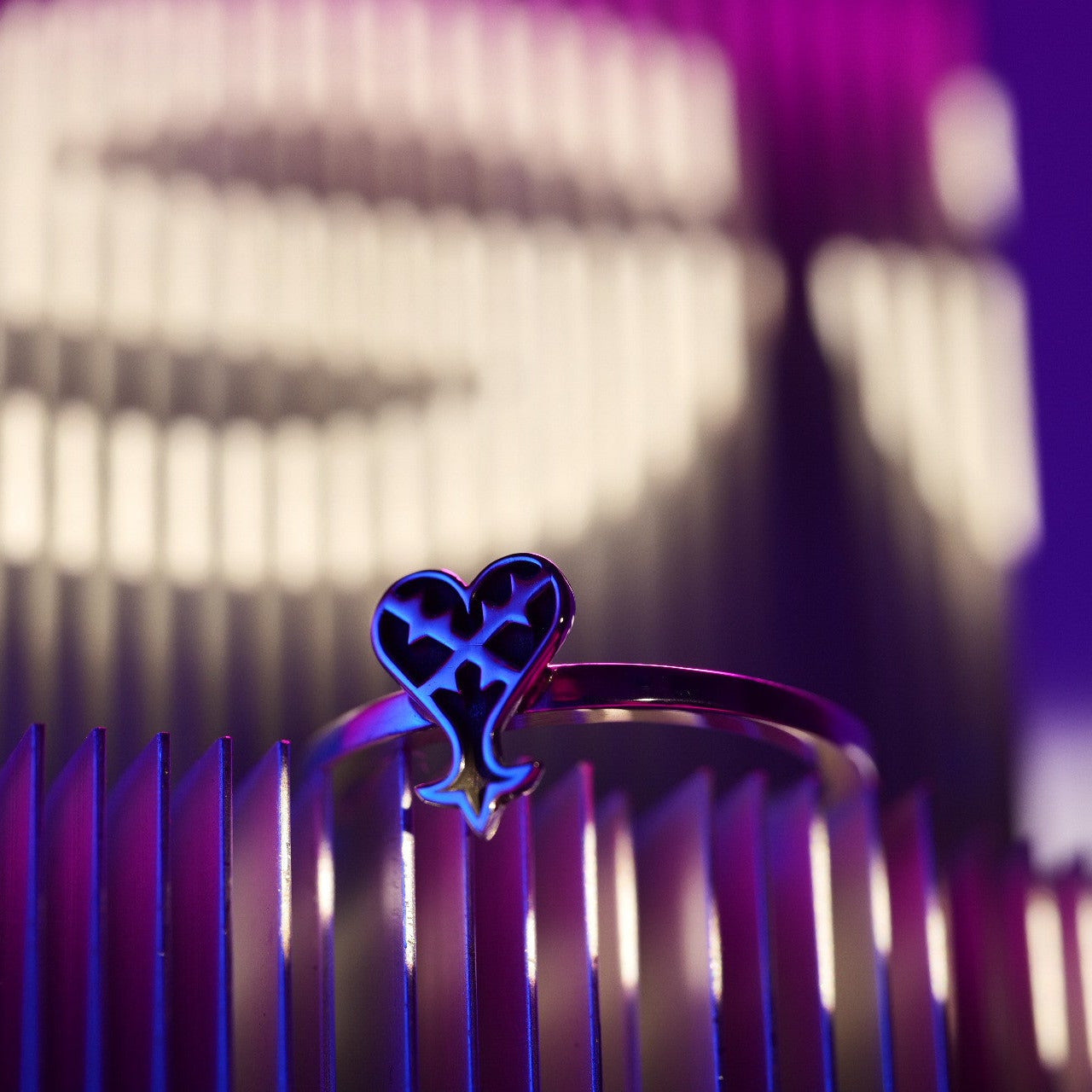 Full view of Kage ring in sterling silver with inverted heart symbol