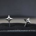 Kunai earrings in sterling silver shaped like shuriken with embedded effect design