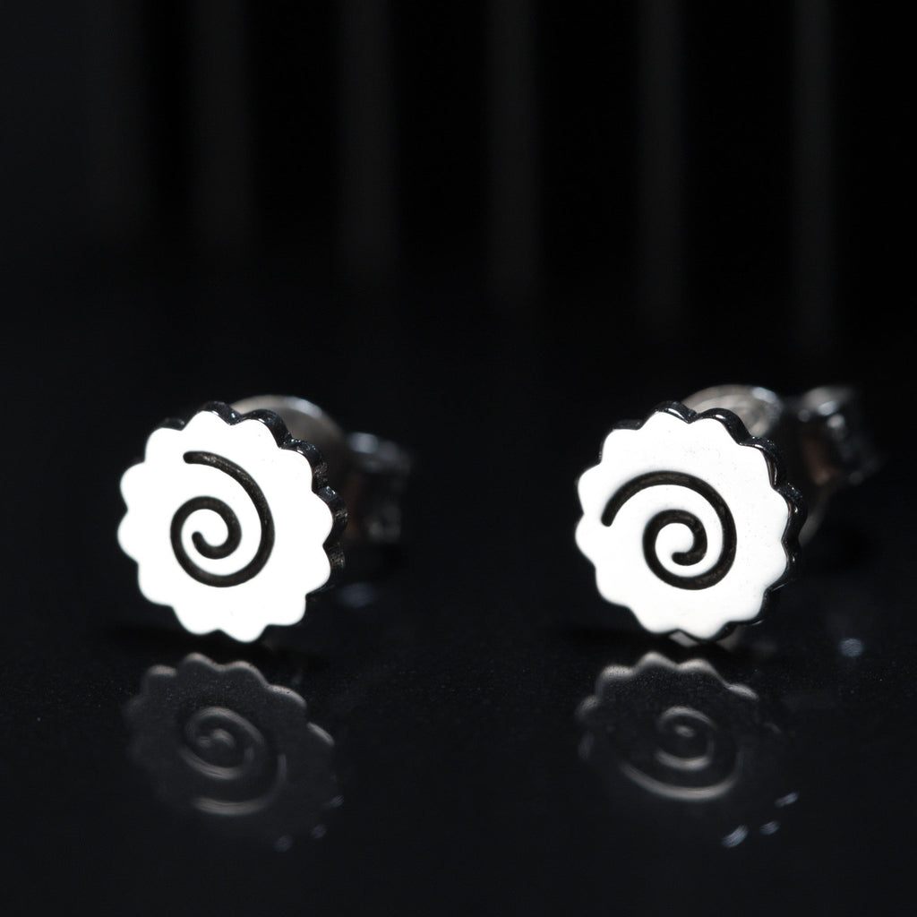 Ramen earrings worn, showing small and playful spiral design