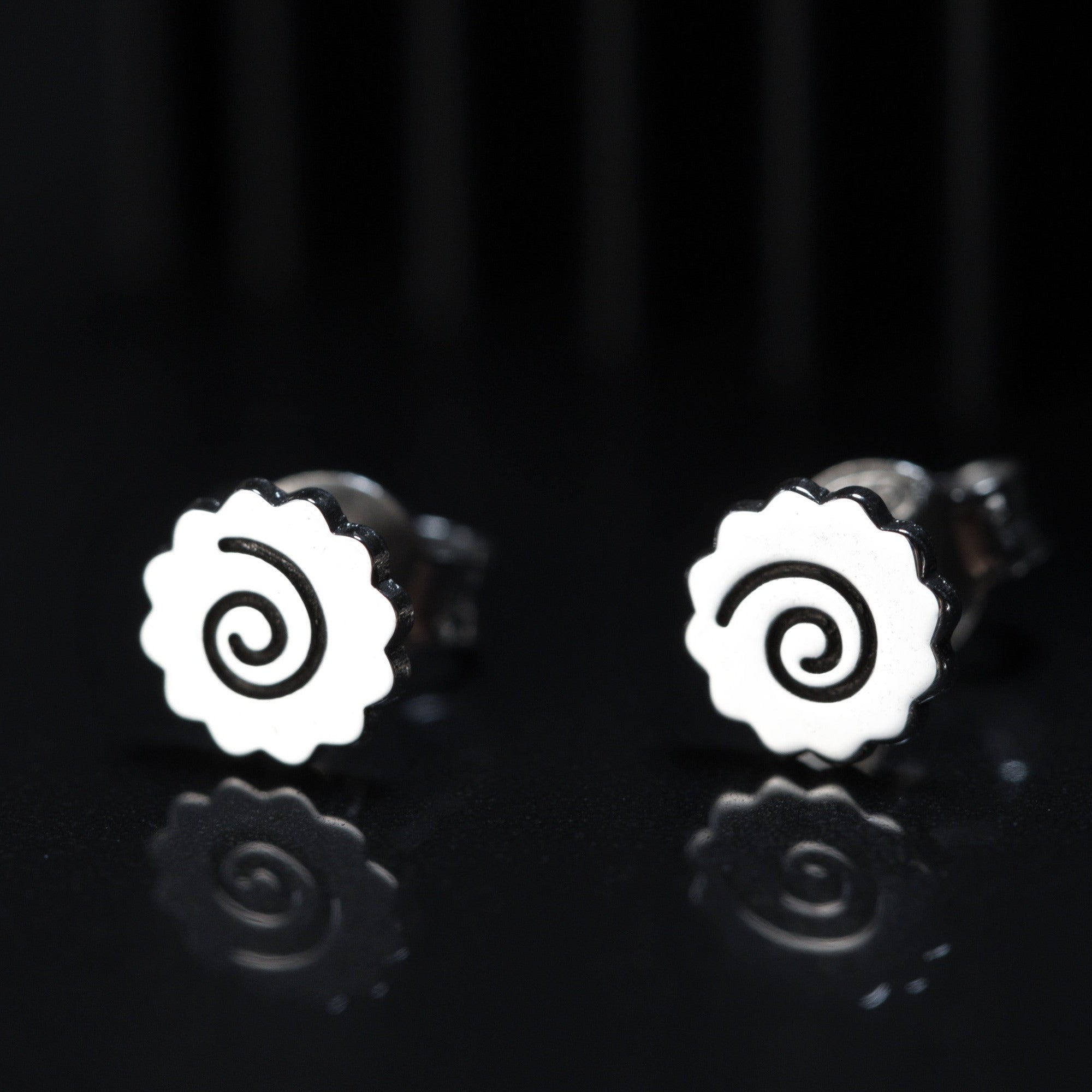 Ramen earrings worn, showing small and playful spiral design
