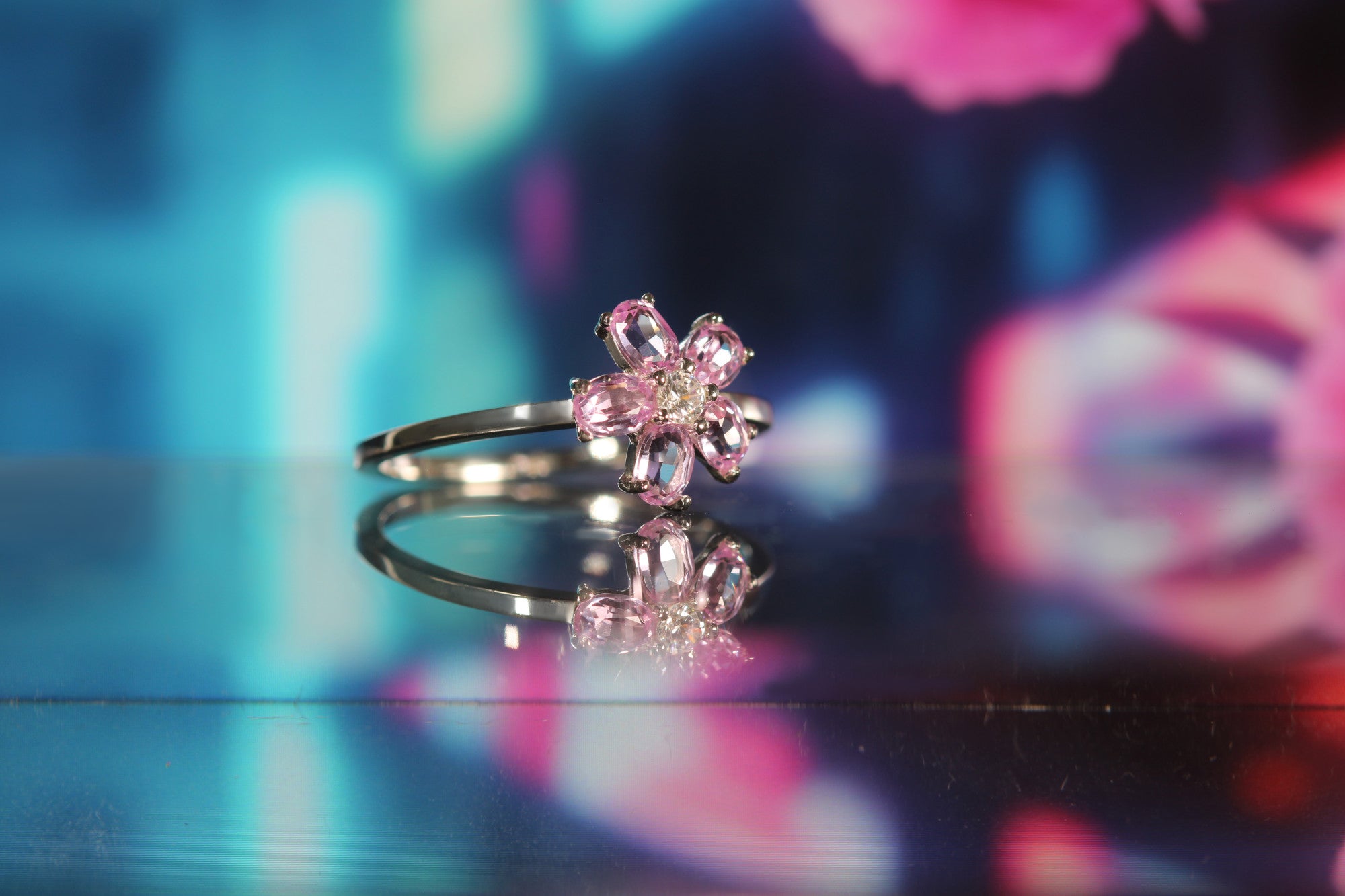 Detail of Sakura ring showing five-petal flower design in sterling silver