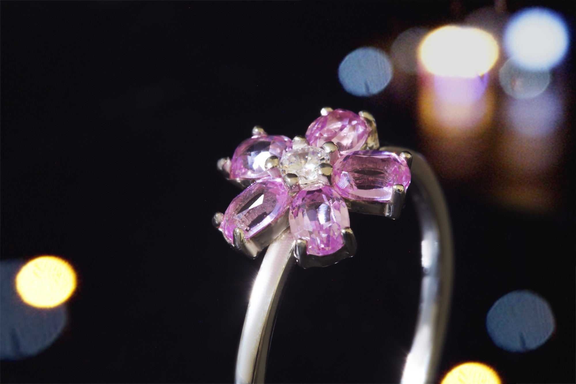 Sakura ring in sterling silver with ruby petals and white zirconia center