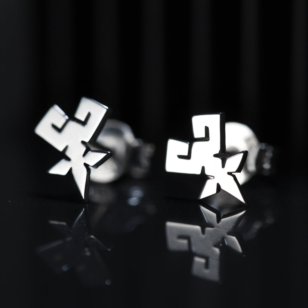Detail of Shihan stud earrings showing clean and precise symbol in sterling silver