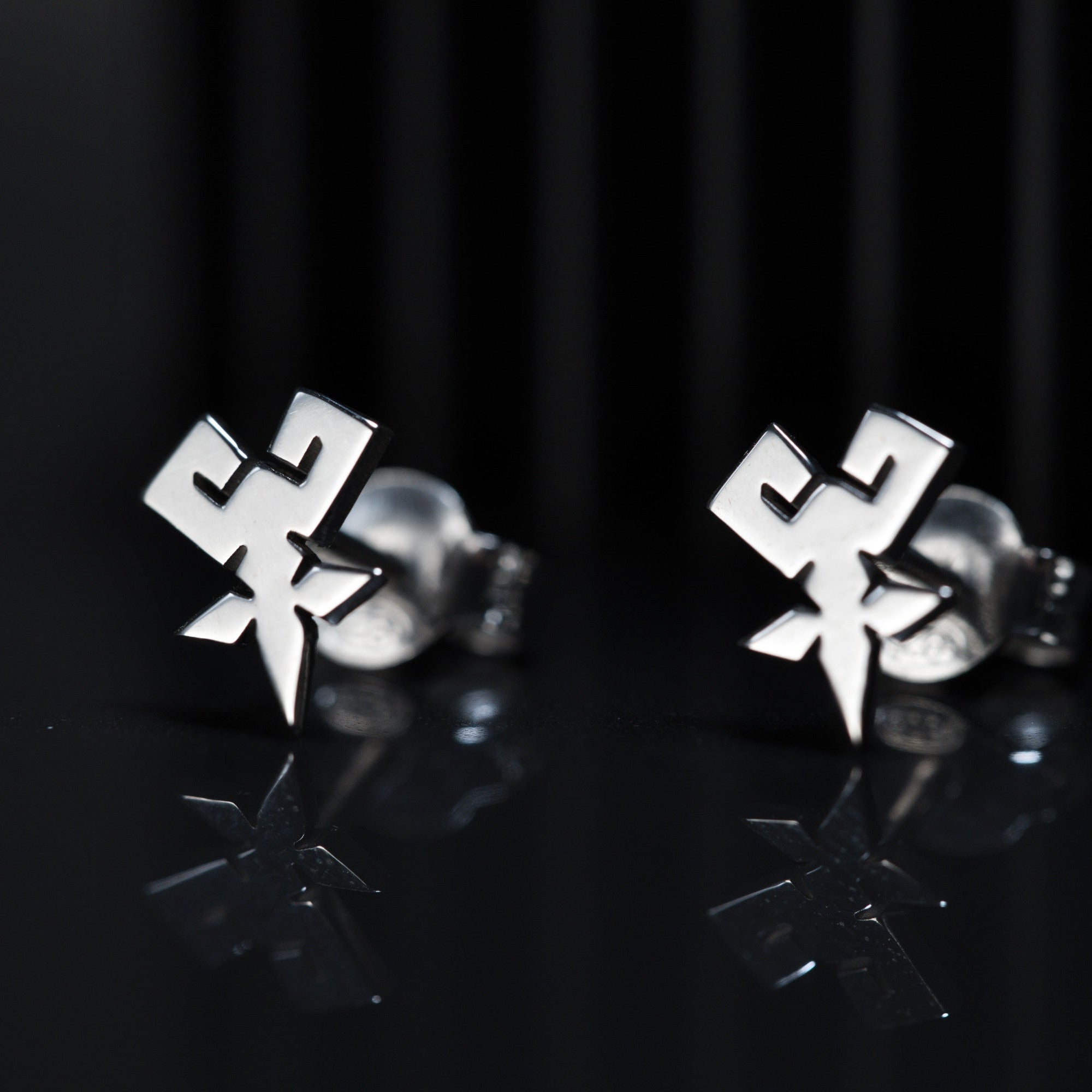 Shihan stud earrings in sterling silver with mastery symbol design