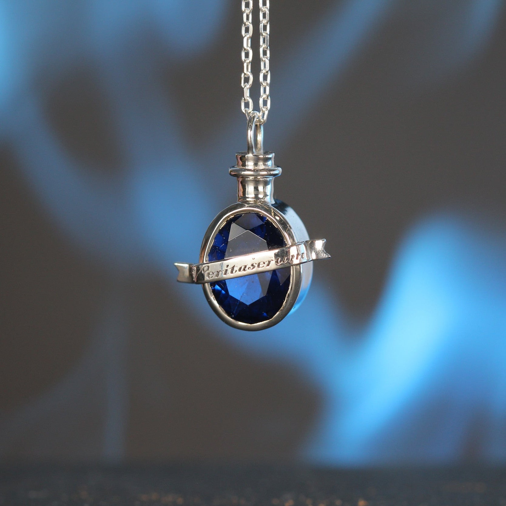 Detailed view of potion pendant and chain